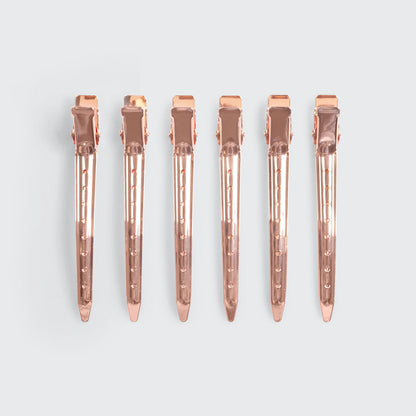 Kitsch Hair Rollers and Styling Clips Bundle styled with hair-care props on a warm background
