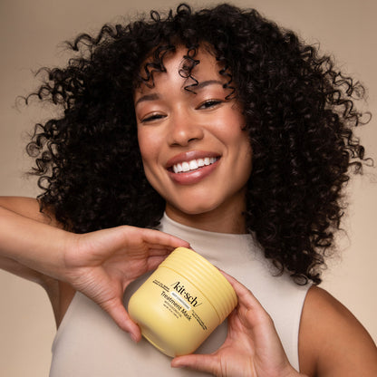 Model applying KITSCH Coconut Oil Deep Conditioning Treatment Mask – curly hair hydration