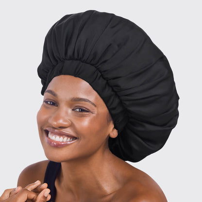 KITSCH XL Adjustable Satin Sleep Bonnet in Black — lifestyle beauty shot — adjustable fit for all head sizes